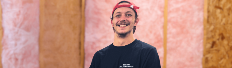 a man smiling at the camera